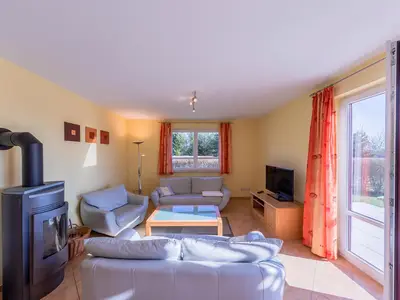 Ferienwohnung Storchenruh Wohnzimmer mit Kamin
