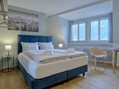 Wohnzimmer / Doppelbett / Essbereich / Küche