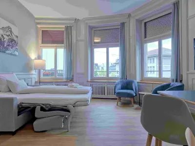 Wohnzimmer / Sofabett / Essbereich / Küche