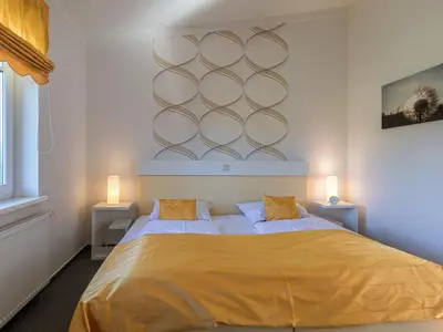 Ferienwohnung Zwergtaucher Schlafzimmer mit gemütlichem Doppelbett