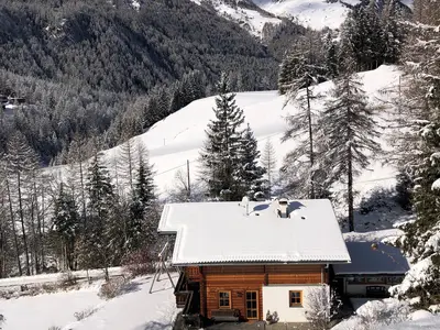 App-Evi-Haus-und-Berge-Wi-2026