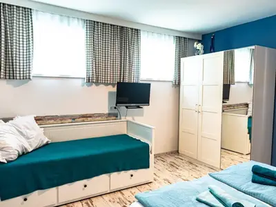 Schlafzimmer mit Zustellbett