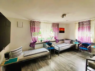 Schlafzimmer „Lavendel“ für 3 Personen mit Gartenblick