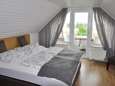 Schlafzimmer mit Balkon