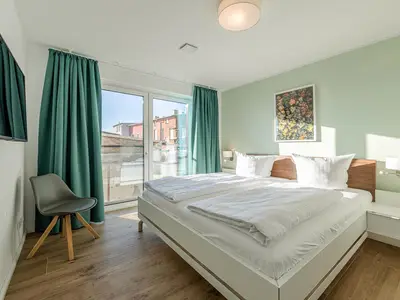 Ferienwohnung Wasserlilie Malchow Blick in eines der Schlafzimmer
