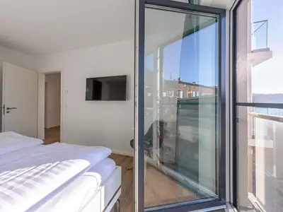 Ferienwohnung Wasserlilie Malchow Schlafzimmer mit Zugang zum Balkon