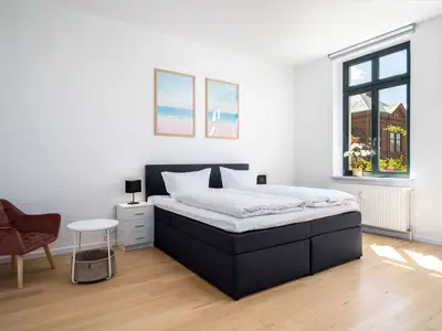 Ferienwohnung BlueSea in Malchow Schlafzimmer mit Doppelbett
