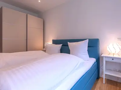 Ferienwohnung Inselpirat Malchow Schlafzimmer mit Doppelbett