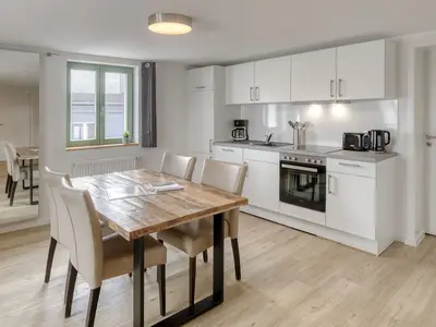 Ferienwohnung City Suite offene Küche mit Essbereich