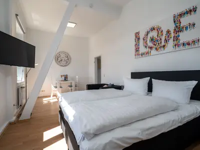 Ferienwohnung SeaLove in Malchow Bett im offenen Schlafbereich