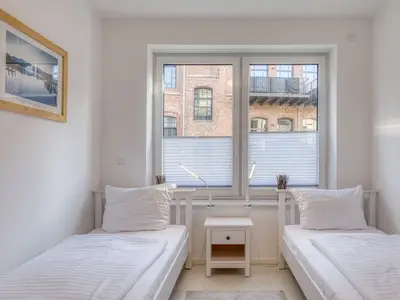 Ferienwohnung Pusteblume in Malchow Schlafzimmer mit zwei Einzelbetten