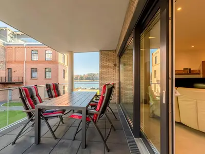 Ferienwohnung Pusteblume in Malchow Balkon mit Sitzmöbeln