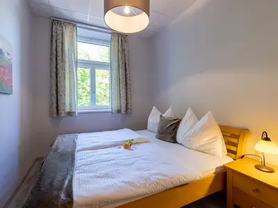 Herrenhaus TOP1 Schlafzimmer.jpg