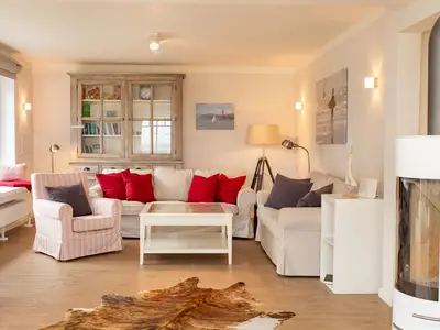 Wohnzimmer mit gemütlichem Ofen in der Ferienwohnung "Paradies"