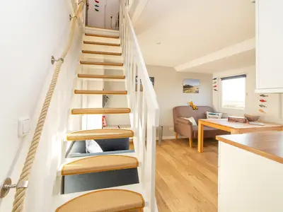 Treppe mit maritimen Detail in der Ferienwohnung Wiese & Watt