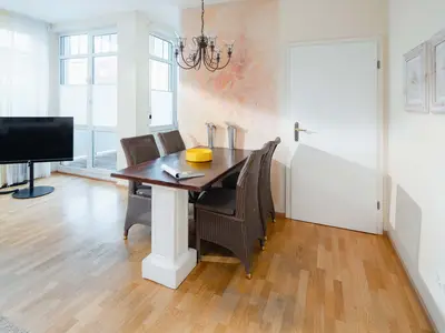 die insellotsen Norderney / Fewo Wanderdüne - Wohnzimmer mit Esstisch