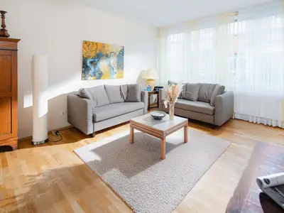 die insellotsen Norderney / Fewo Wanderdüne - Wohnzimmer mit Schlafsofa (Platz für 1 Kind)