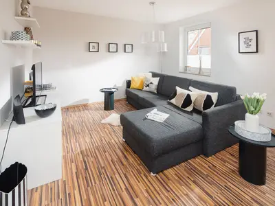 die insellotsen Norderney / Fewo Nordhelmeck 2 - Wohnzimmer