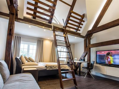 Deluxe Suite_Bett und Empore Deluxe Suite_Bett und Empore