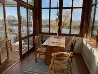 Wintergarten mit Austritt auf die Veranda