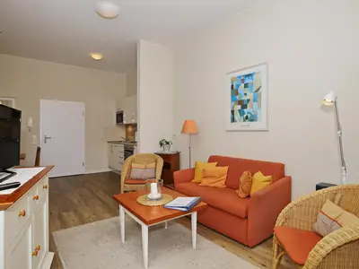 Wohnzimmer mit Sitzecke und TV Wohnzimmer mit Sitzecke und TV