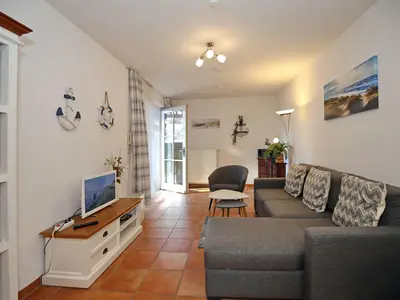 Wohnzimmer mit Zugang zur Terrasse