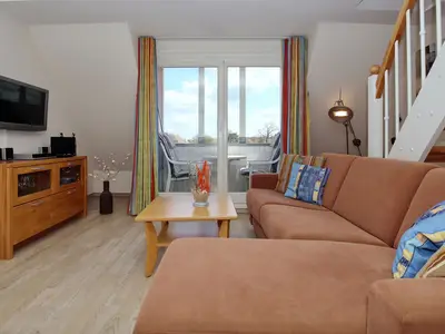 Wohnzimmer mit Sitzecke und TV Wohnzimmer mit Sitzecke und TV