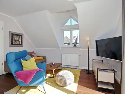 Wohnbereich mit Sitzecke und TV