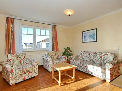 Wohnbereich mit Sofa uns Sesseln