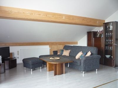 Wohnbereich mit ausziehbarem Sofa Dachgeschoss