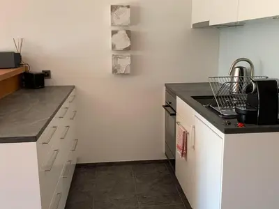 Modern und komplett ausgestattete Küche für eigene Gourmetfreuden inkl. Espressomaschine