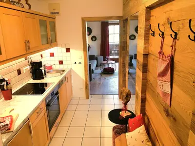 Ferienwohnung "Geigelstein": Eingangsbereich mit einladender Garderobe...