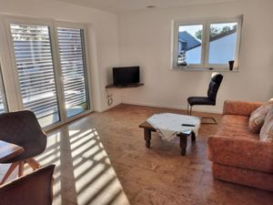 Wohnzimmer mit gemütlicher Schlafcouch