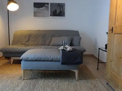 Wohnzimmer mit Schlafsofa