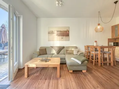 Ferienwohnung SeeBrise Röbel Wohnzimmer mit Terrasse