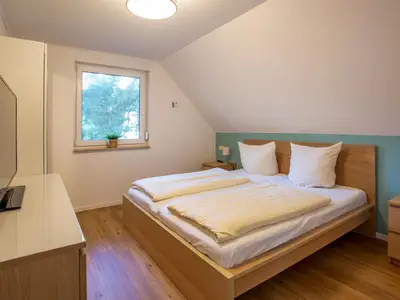 Ferienwohnung Merlin Ausguck Röbel/Müritz Schlafzimmer mit Doppelbett