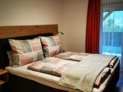 Schlafzimmer mit Balkon