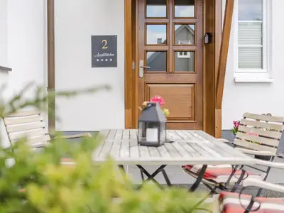 Ferienwohnung Eingangsbereich mit Sitzgelegenheit