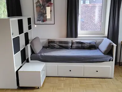 Wohnzimmer mit Bett