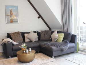 Wohnzimmer mit gemütlichem Sofa