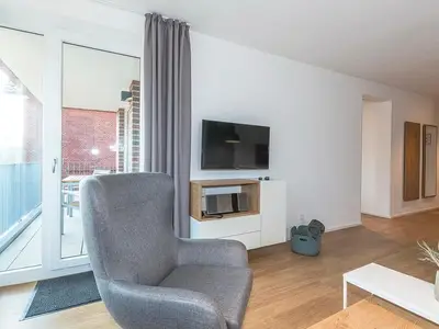 Wohn-Essbereich mit Zugang zum Balkon