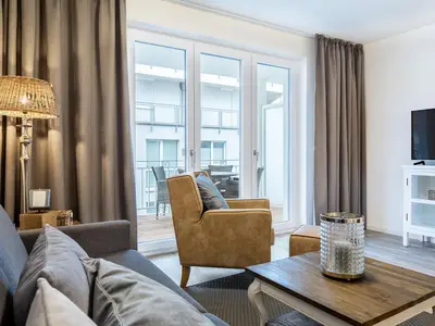 Wohn-/Essbereich mit Zugang zum Balkon