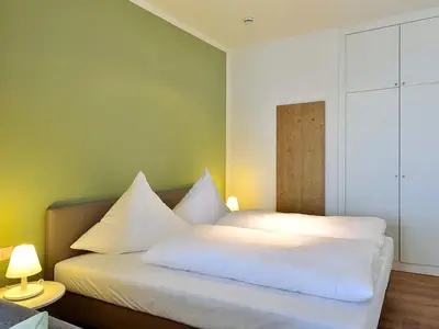 Schlafbereich mit Doppelbett