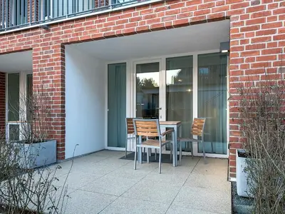 Überdachte Terrasse mit Sitzgelegenheit