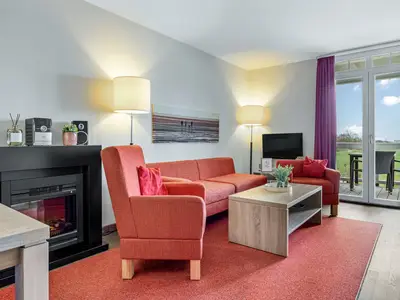 Wohnbereich mit Sofa, Sessel, Couchtisch
