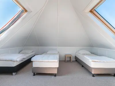 Schlafzimmer mit 3 Betten