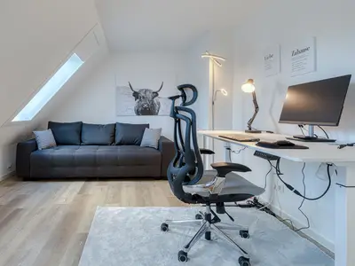 Ferienwohnung Lakeside House Abreitszimmer mit Couch