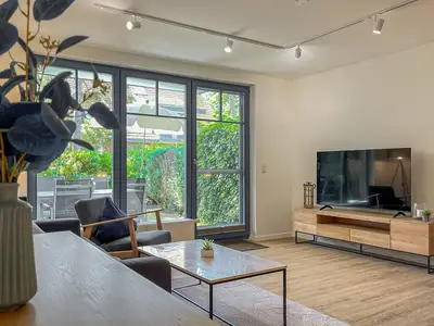 Wohnbereich mit Sitzecke und TV