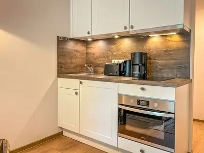 Küchenzeile im Wohnzimmer integriert