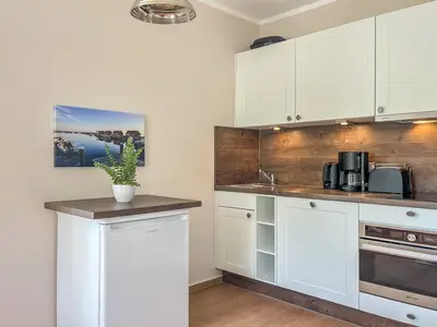 Küchenzeile im Wohnzimmer integriert